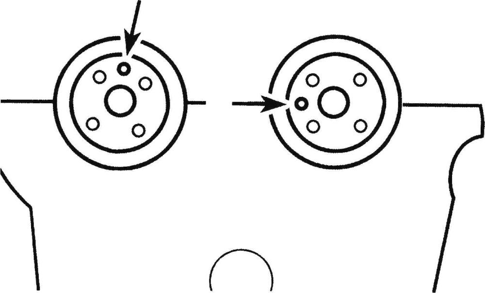 Rotate the left (driver's) side cylinder head camshafts so the dowel pins are positioned like this (TDC position), then install the camshaft holding tool